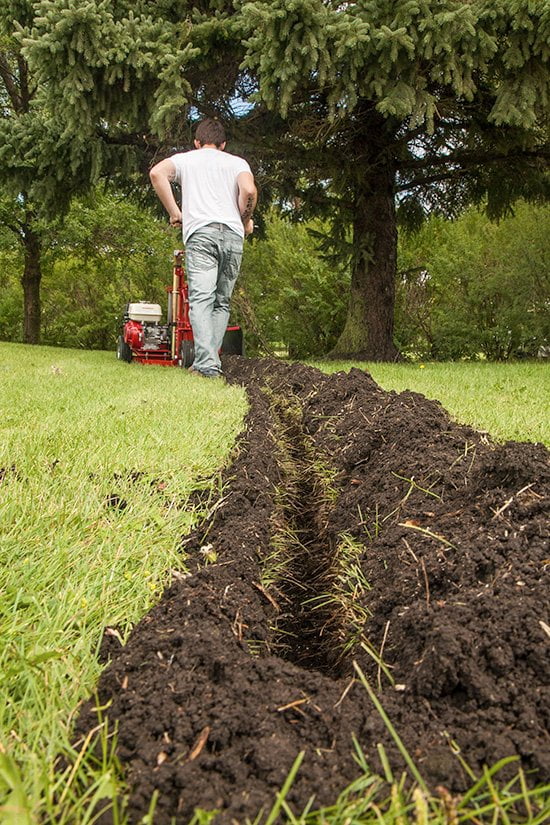 Kwik-Trench leaves a clean cut with dirt deposited on one side of the trench